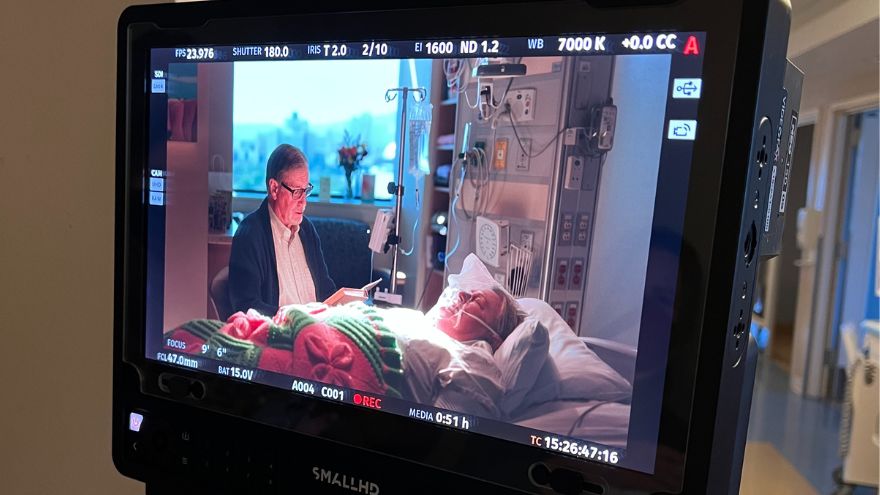 Ann and chris cook by renown regional bedside during filming of new commercial