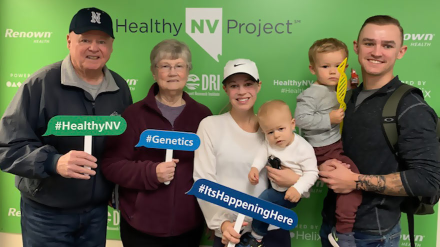 A family holding HealthyNV banners