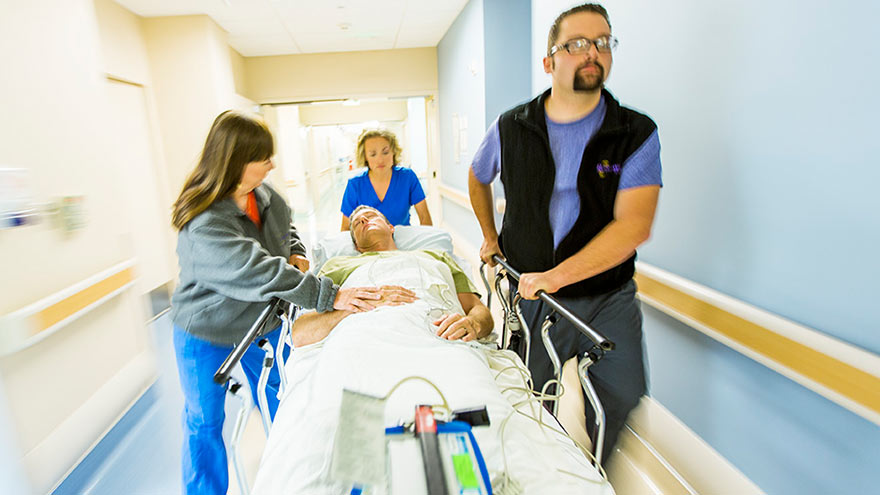 Patient being rushed into the emergency room