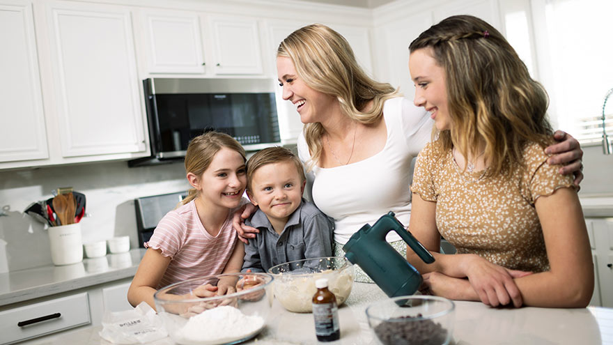 Family in kitchen cooking together