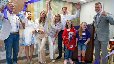 Steve Young, Kent and Anne-Marie Barton, Jacquelyne Love, Dr. Brian Erling and Renown patients and team members celebrate the grand opening of Sophie's Place at Renown Children's Hospital.