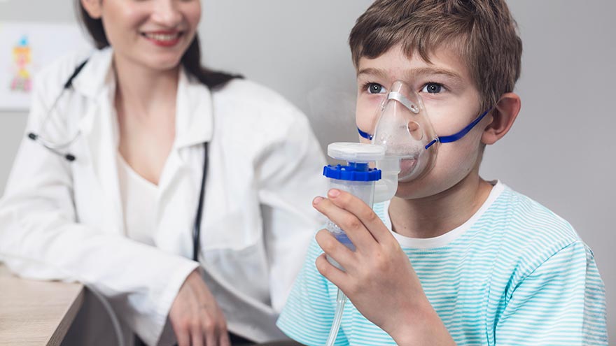 Parent helps child use inhaler