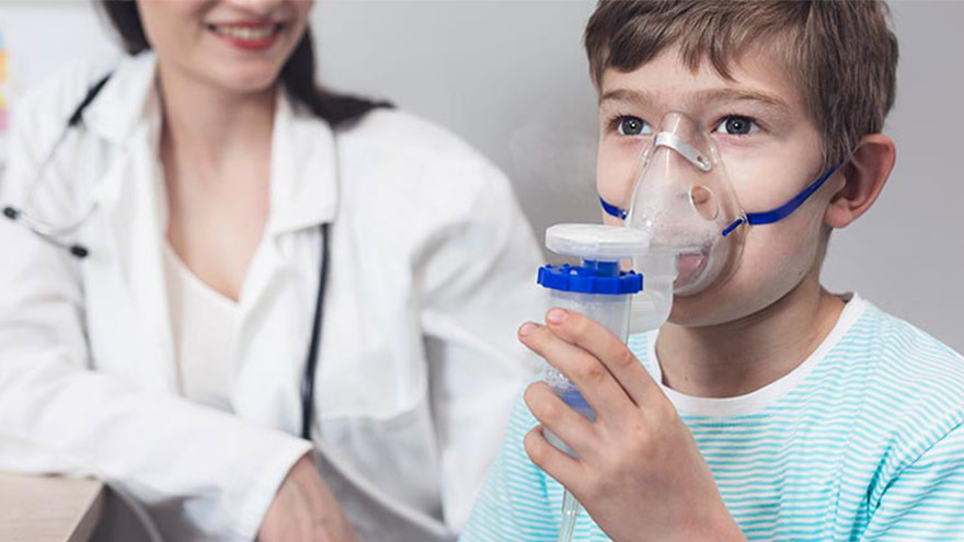 Provider helping child with breathing treatment
