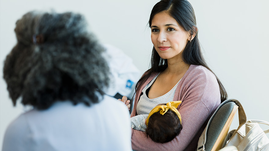 New mom consulting with provider regarding postpartum care