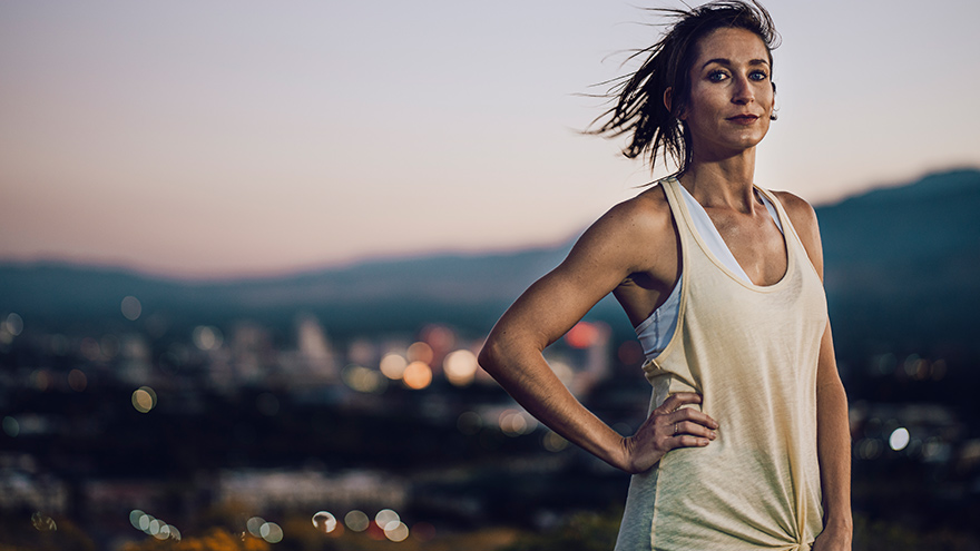 Woman out jogging with Reno in background