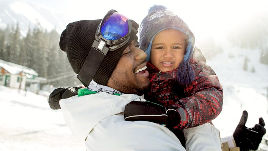Father and small son at a ski resort